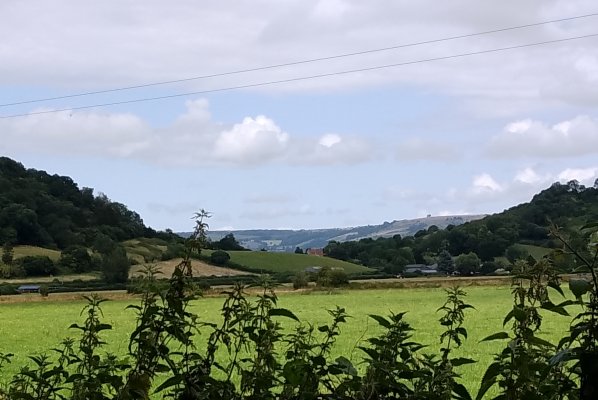 View to the Mendip Hills between 2 hills.