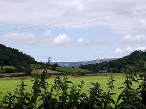 View to the Mendip Hills between 2 hills.