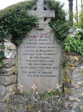 the plaque is set in a wall and features the names of 3 men of the village fallen in the First World War.