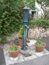 A Victorian pump, painted green, at Easton