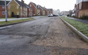 Picture of a drain on an estate & incomplete works, leading to the road being unadopted.